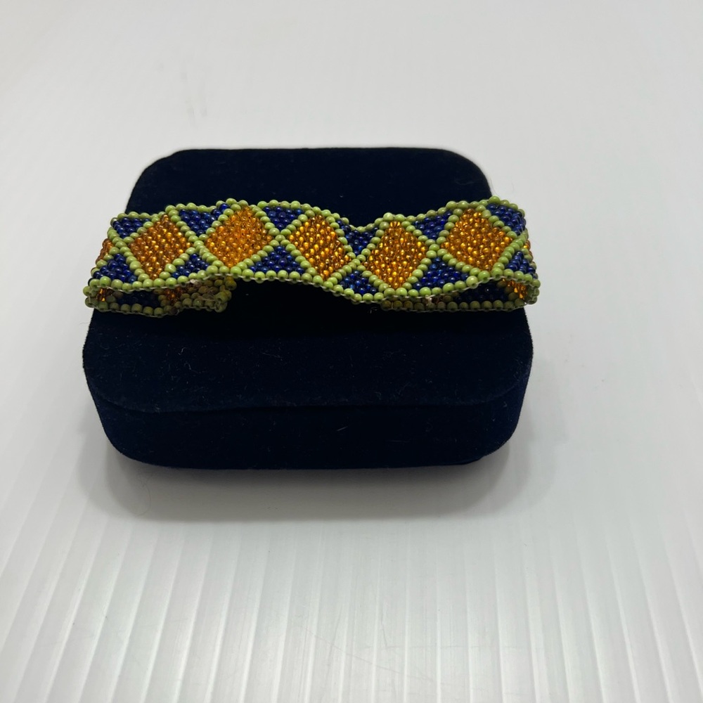 Vibrant Beaded Bracelet with Orange and Blue Accents handmade
